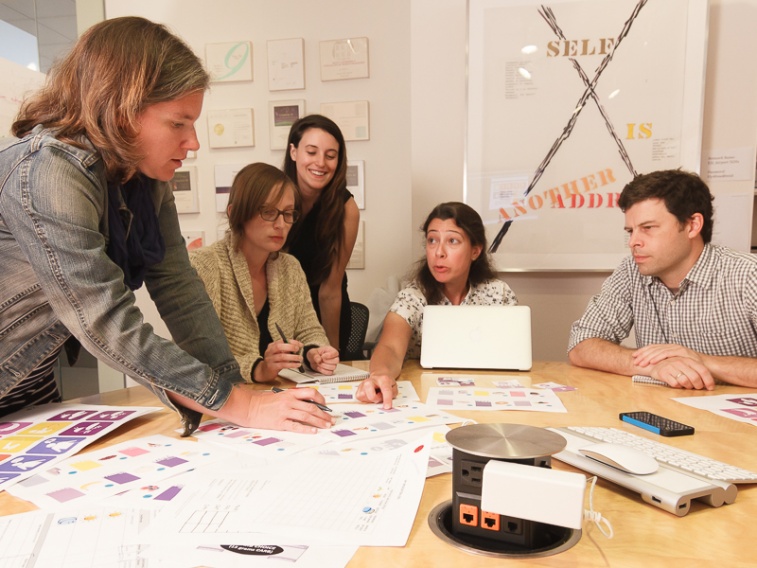 The team works together on the redesign of CHW's graphic identity and tools.